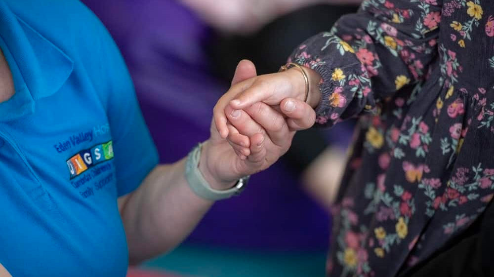 A colourful logo for Eden Valley Hospice and Jisgsaw Children's Hospice, including their blue heart logo