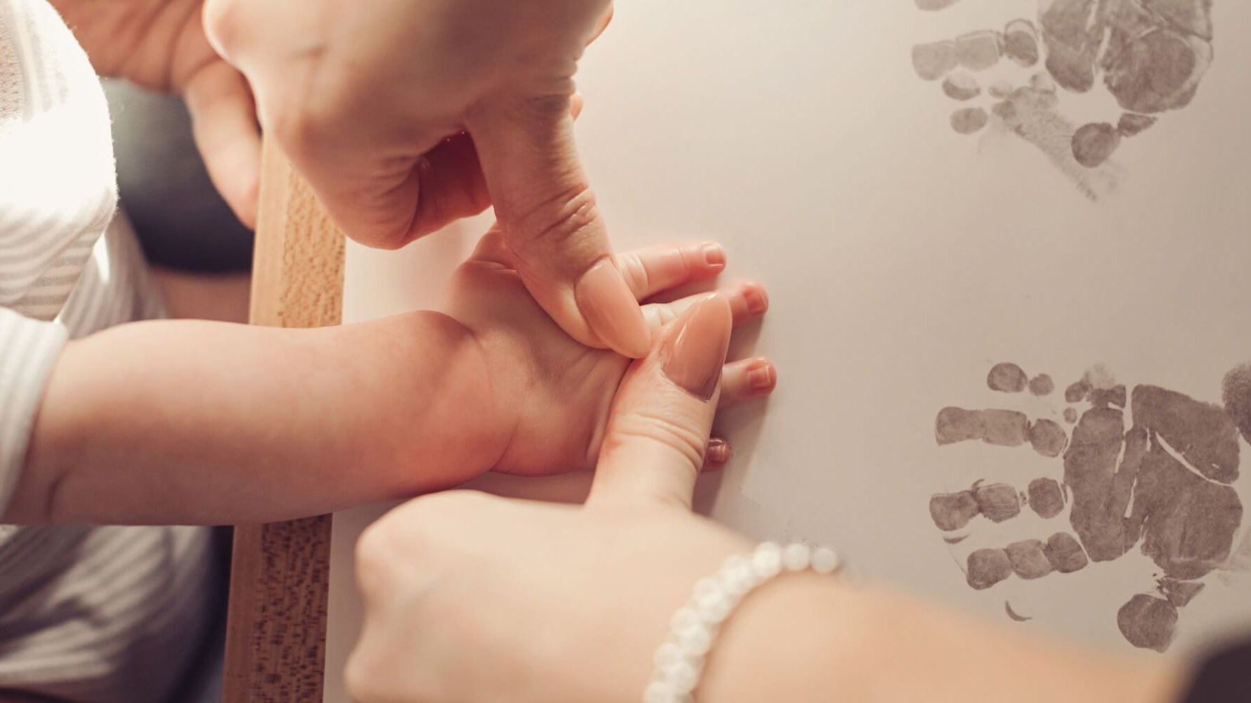 Taking baby handprints using Inkless Printing Kits