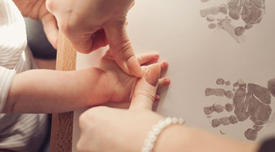 Taking baby handprints using Inkless Printing Kits