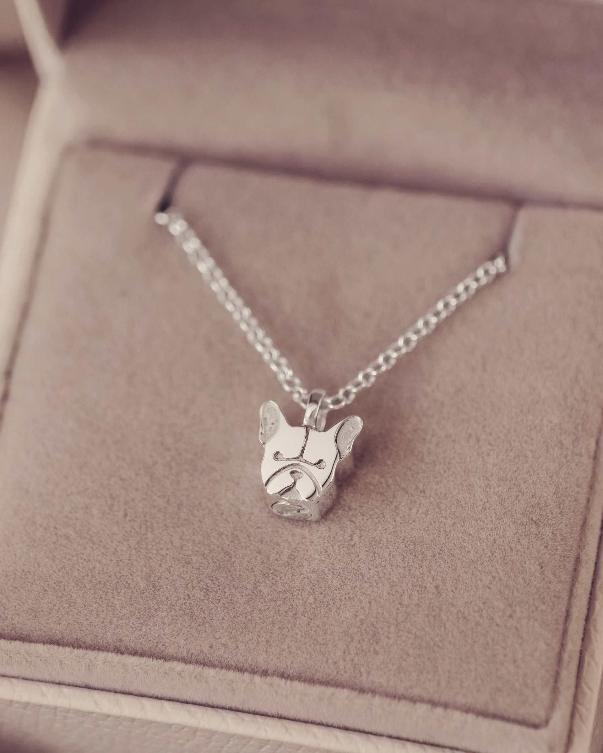 Silver dog-shaped frenchie pendant necklace in a jewellery box