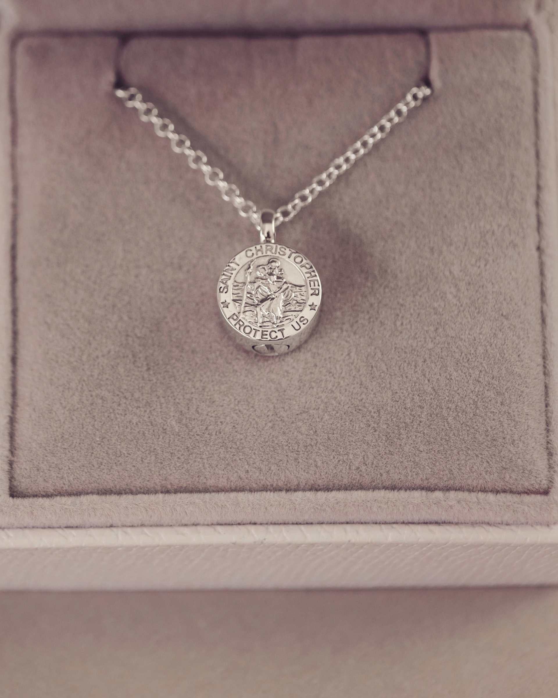 Silver necklace with a St Christopher pendant in a jewellery box