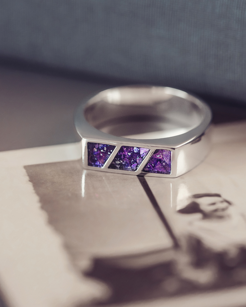 Silver ring with purple gemstones on an old photograph