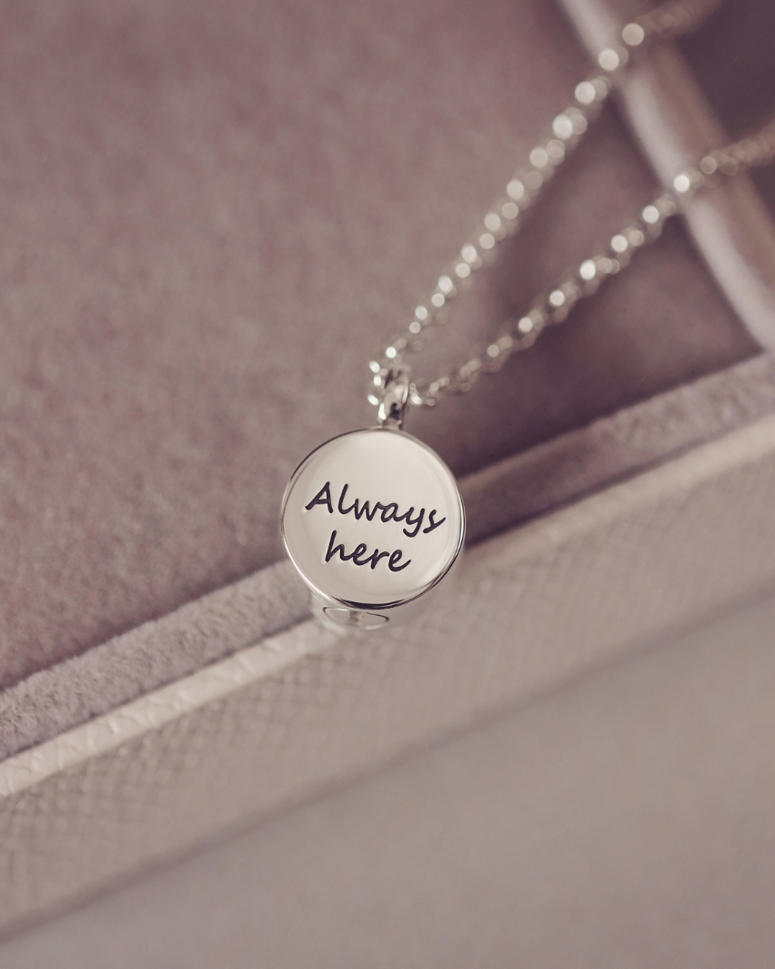 Silver necklace with "Aways here" engraved