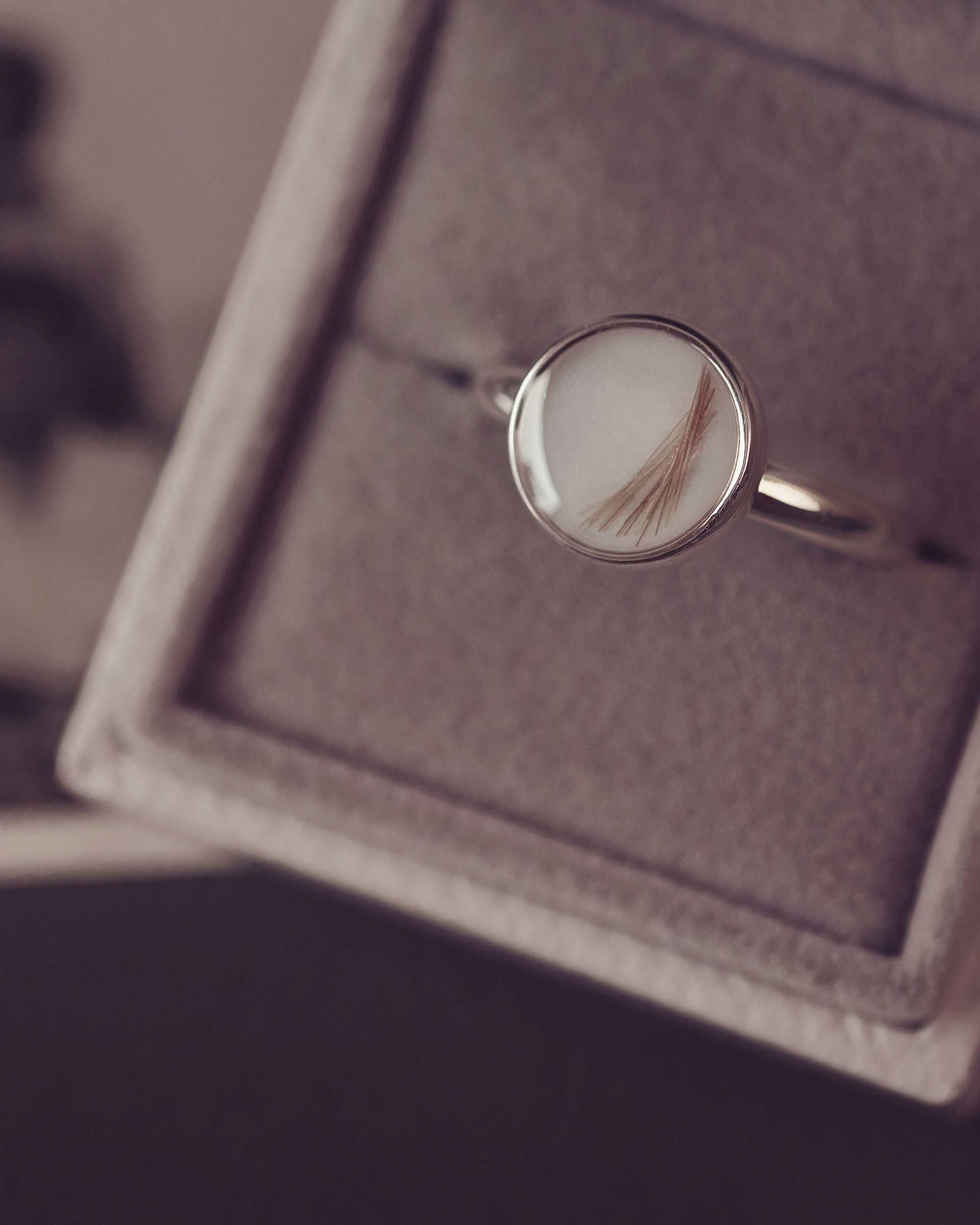 Silver ring with a circular design in a jewellery box