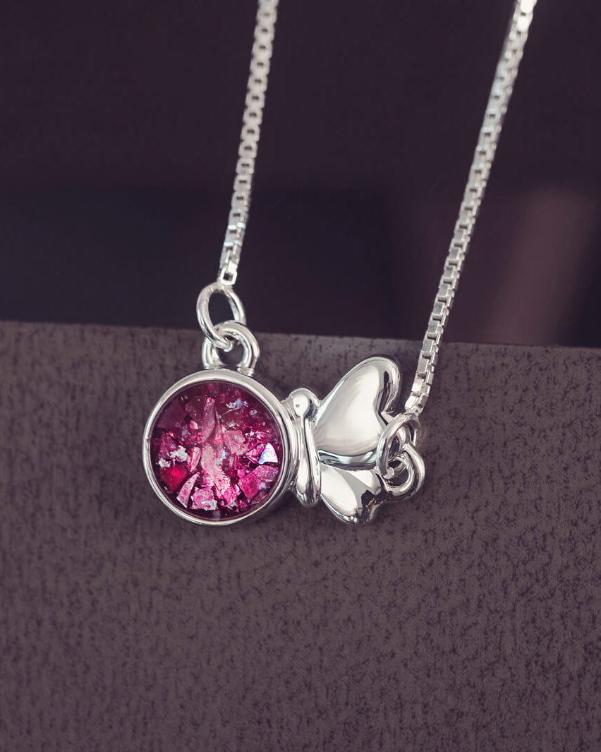 Silver Butterfly Necklace on a chain, filled with pink crystals, resin and cremation ashes