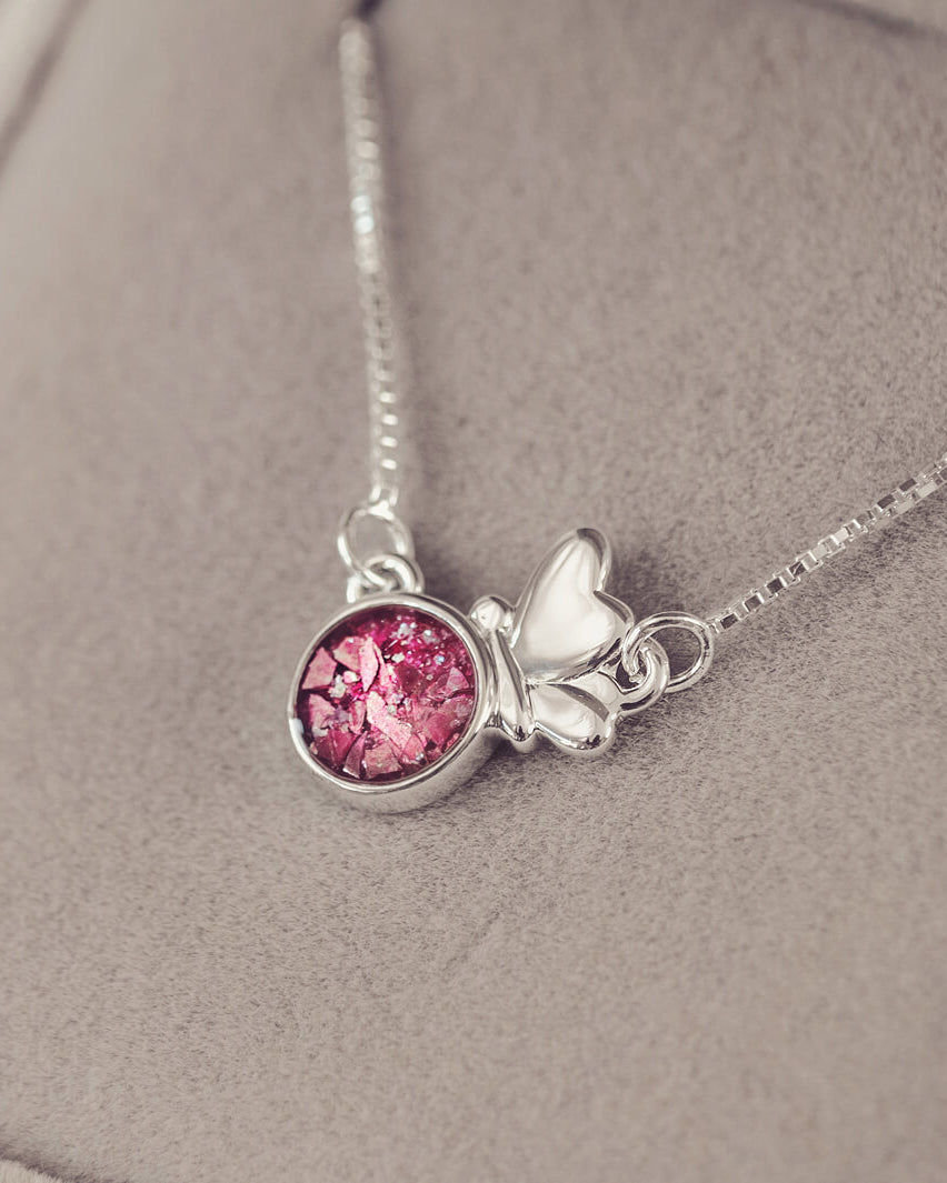 Silver Butterfly Necklace on a chain, filled with pink crystals, resin and cremation ashes