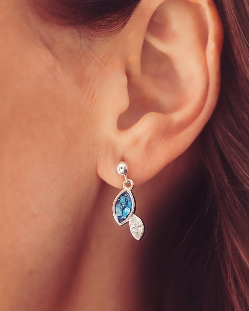 Sterling silver marquise cut earrings, created with cremation ashes, crystal and resin, worn in a ladies ear