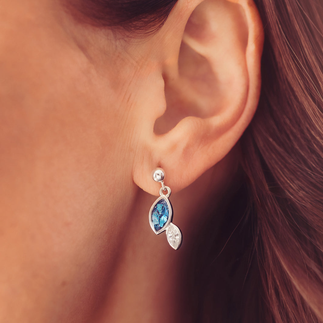 Sterling silver marquise cut earrings, created with cremation ashes, crystal and resin, worn in a ladies ear
