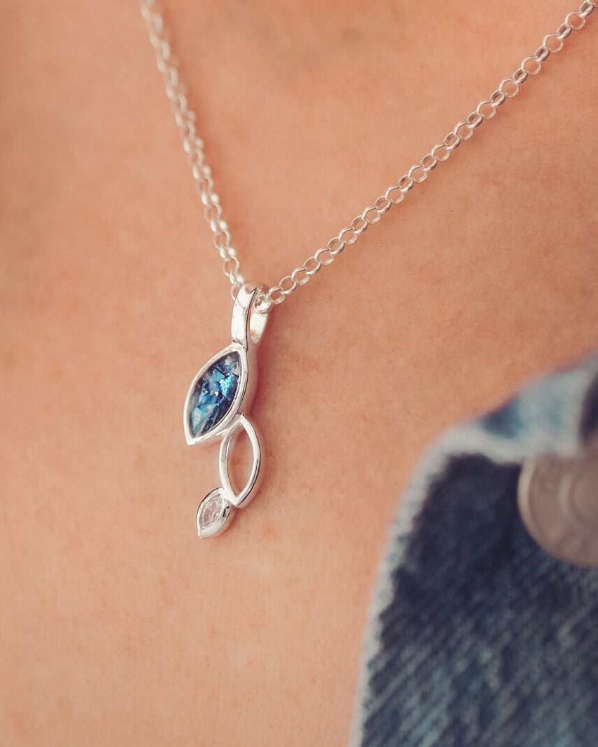 Cremation ashes marquis style cascade necklace on a silver chain, filled with blue crystal and ashes