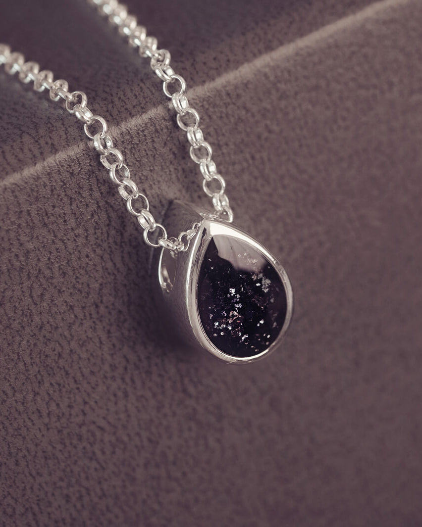 Peardrop shaped silver pendant, filled with black crystal & cremation ashes, on a silver chain