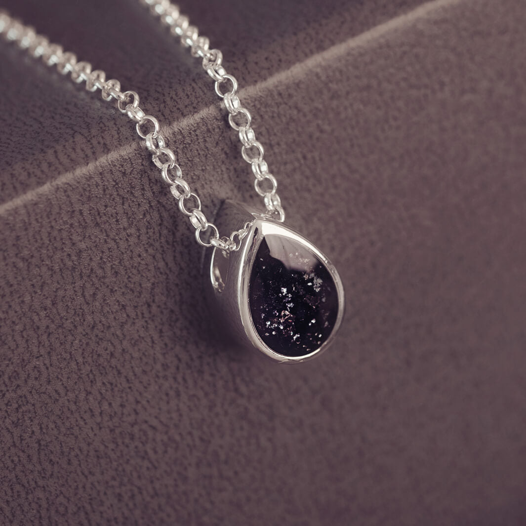 Peardrop shaped silver pendant, filled with black crystal & cremation ashes, on a silver chain