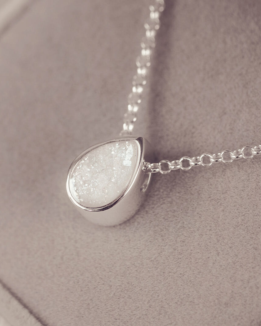 Peardrop shaped silver pendant, filled with white crystal & cremation ashes, on a silver chain