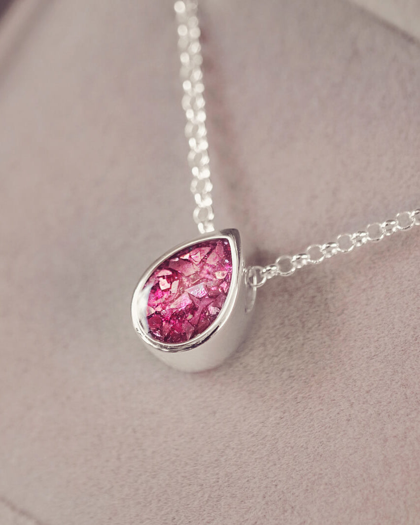 Peardrop shaped silver pendant, filled with pink crystal & cremation ashes, on a silver chain