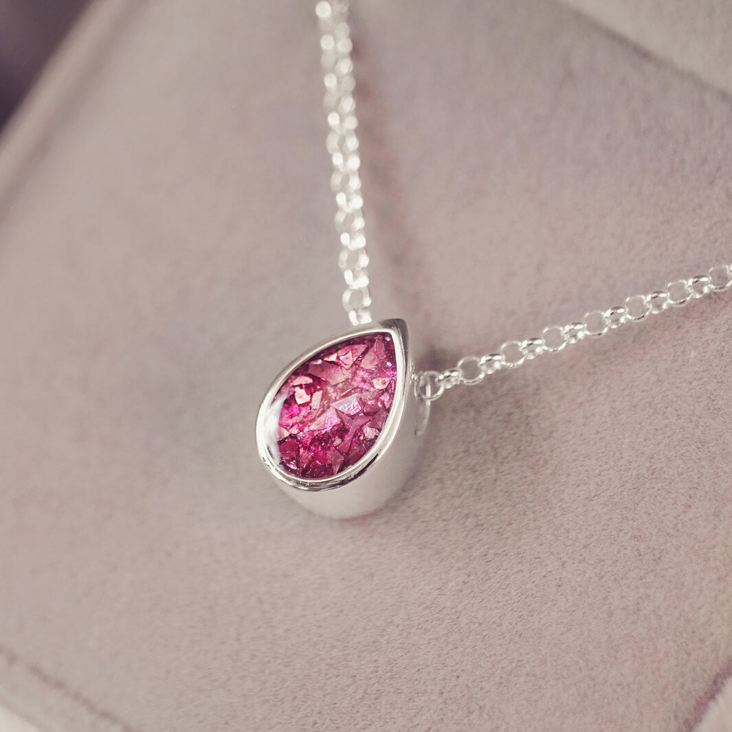 Peardrop shaped silver pendant, filled with pink crystal & cremation ashes, on a silver chain