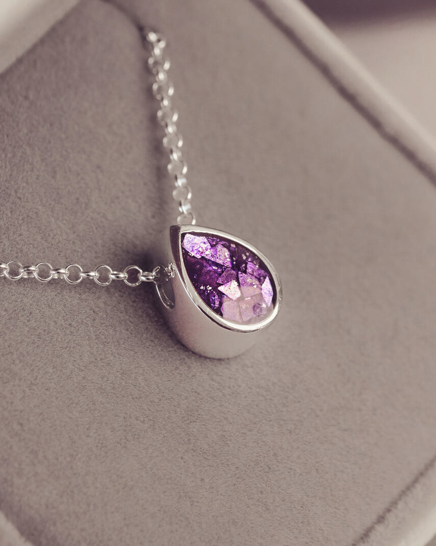 Peardrop shaped silver pendant, filled with purple crystal & cremation ashes, on a silver chain