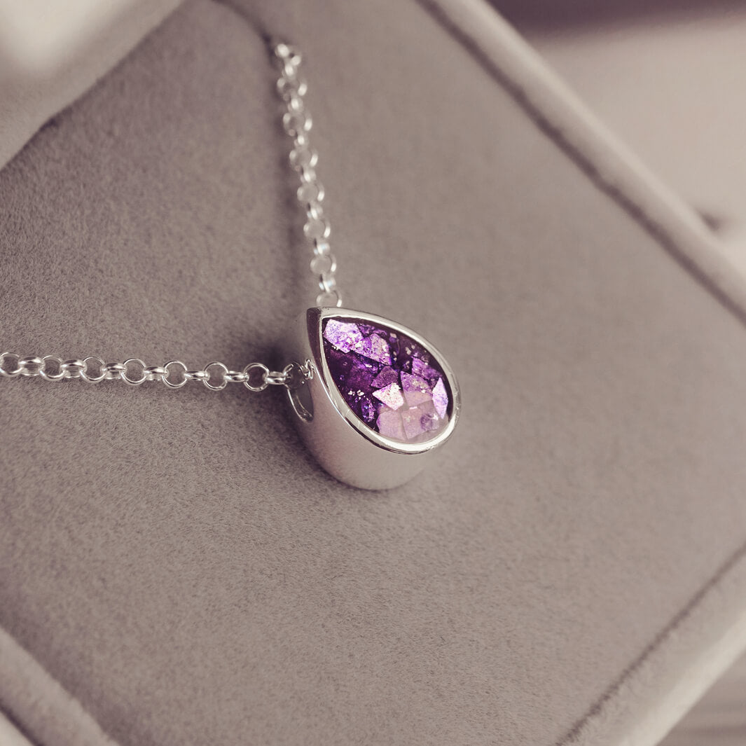 Peardrop shaped silver pendant, filled with purple crystal & cremation ashes, on a silver chain