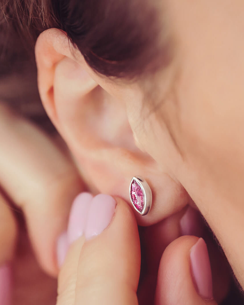 Marquise Style Earrings, worn on a models ear, filled with pink crystal and cremation ashes