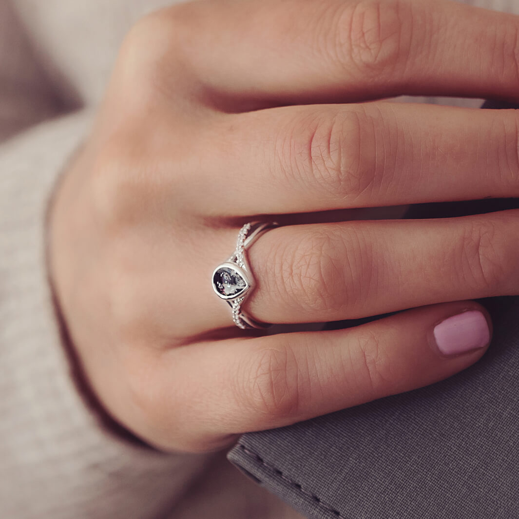 Sterling Silver Peardrop Ring with Crystals on the Band, holding cremation ashes and black crystal