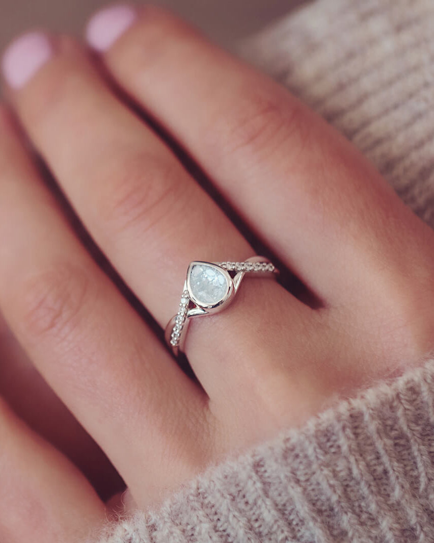 Sterling Silver Peardrop Ring with Crystals on the Band, holding cremation ashes and clear crystal