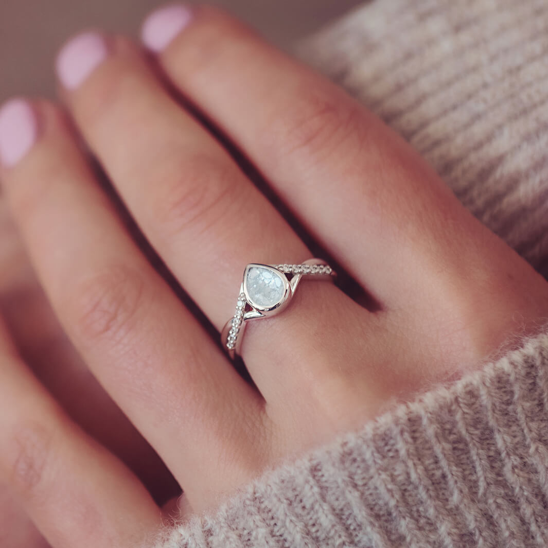 Sterling Silver Peardrop Ring with Crystals on the Band, holding cremation ashes and clear crystal