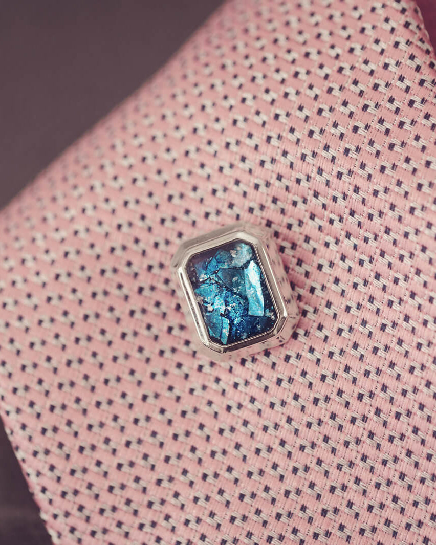 silver tie pin, created with blue crystals, resin and cremation ashes.