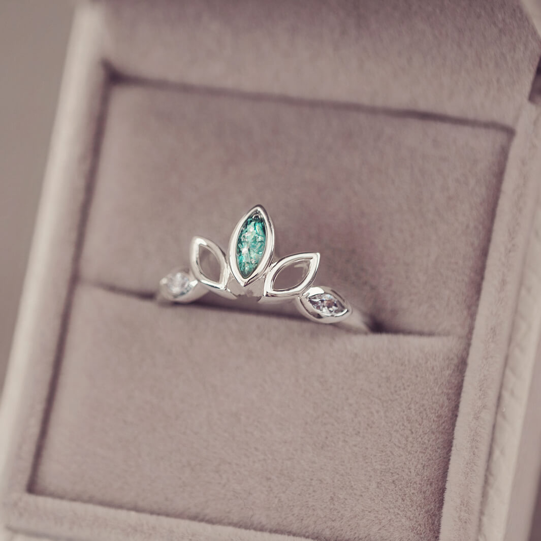 Sterling Silver Ring, created with your loved ones ashes, with Cubic Zircona gemstones. Green floating crystals with in piece in a grey jewellery box