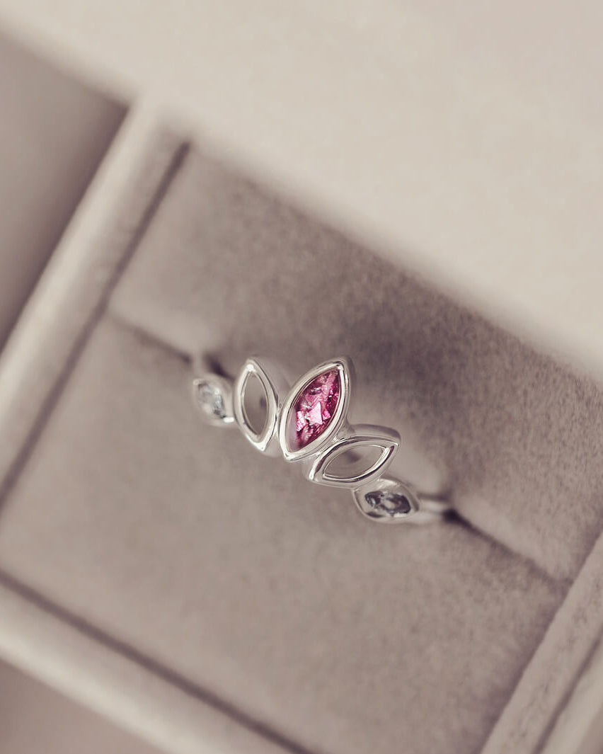 Sterling Silver Ring, created with your loved ones ashes, with Cubic Zircona gemstones. Pink floating crystals with in piece in a grey jewellery box