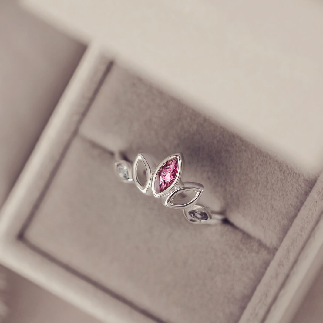 Sterling Silver Ring, created with your loved ones ashes, with Cubic Zircona gemstones. Pink floating crystals with in piece in a grey jewellery box
