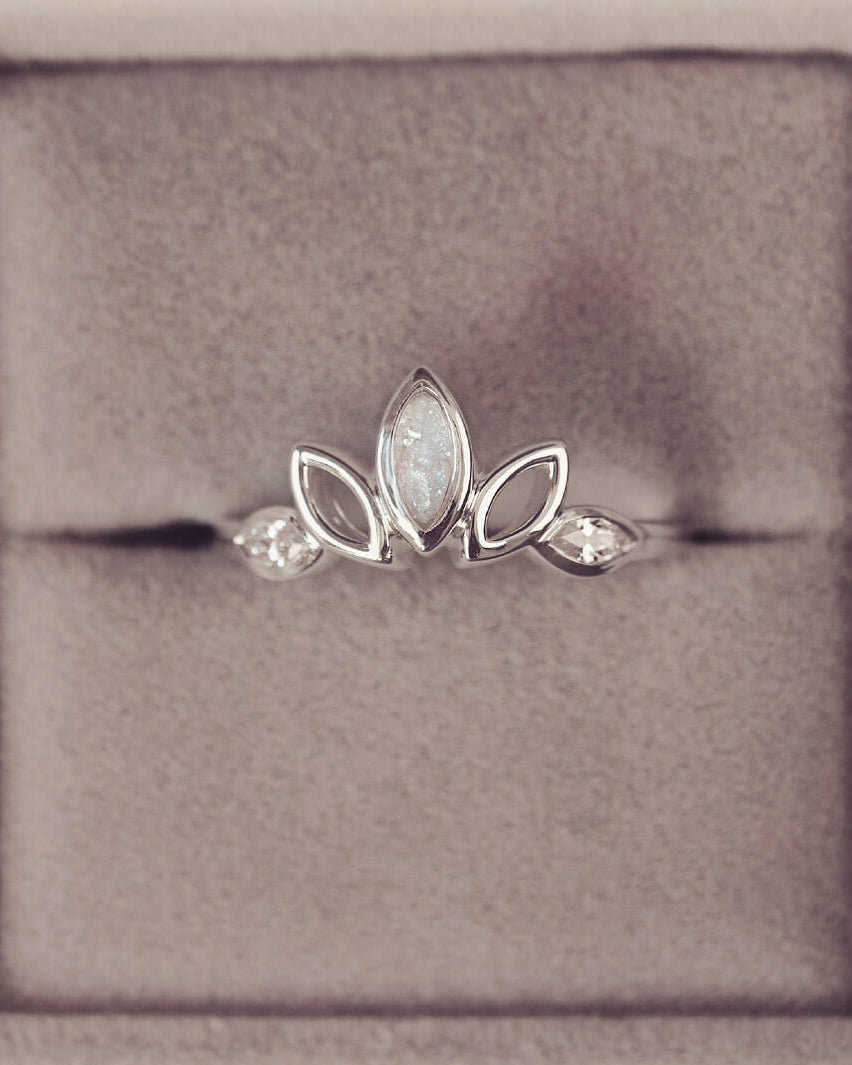 Sterling Silver Ring, created with your loved ones ashes, with Cubic Zircona gemstones. With clear floating crystals with in the ring in a grey jewellery box