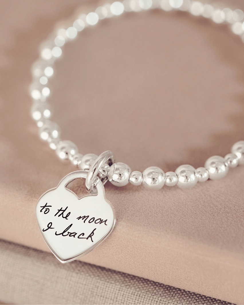 Handwriting on a charm bracelet