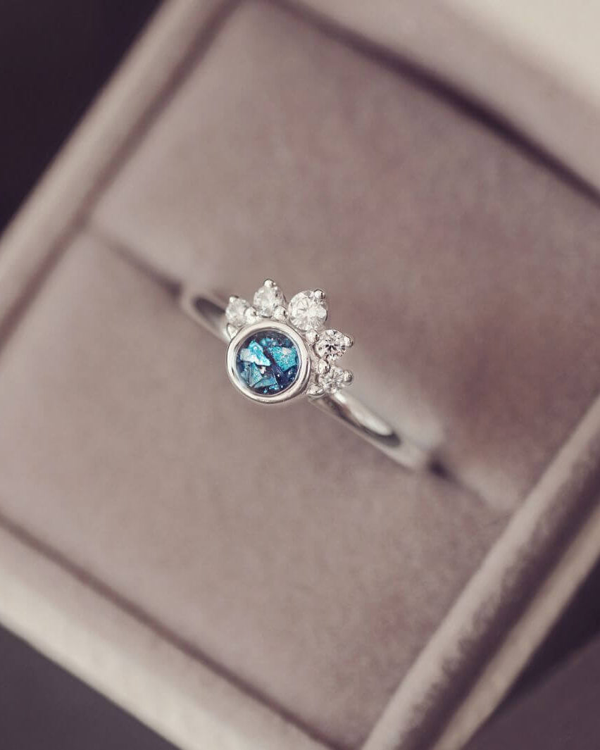 Sterling Silver Ornate Ring with blue gemstone, in a grey jewellery box