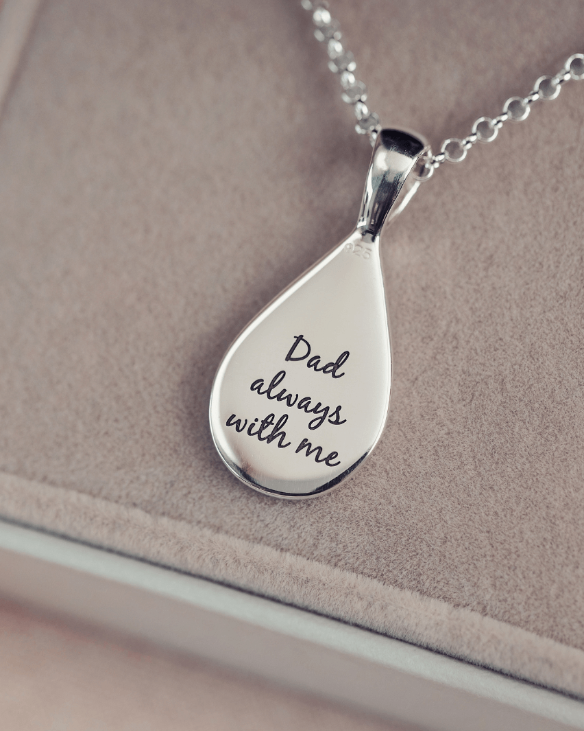 Reverse of a Memorial Ashes Teardrop showing a message in script font reading 'Dad always with me'