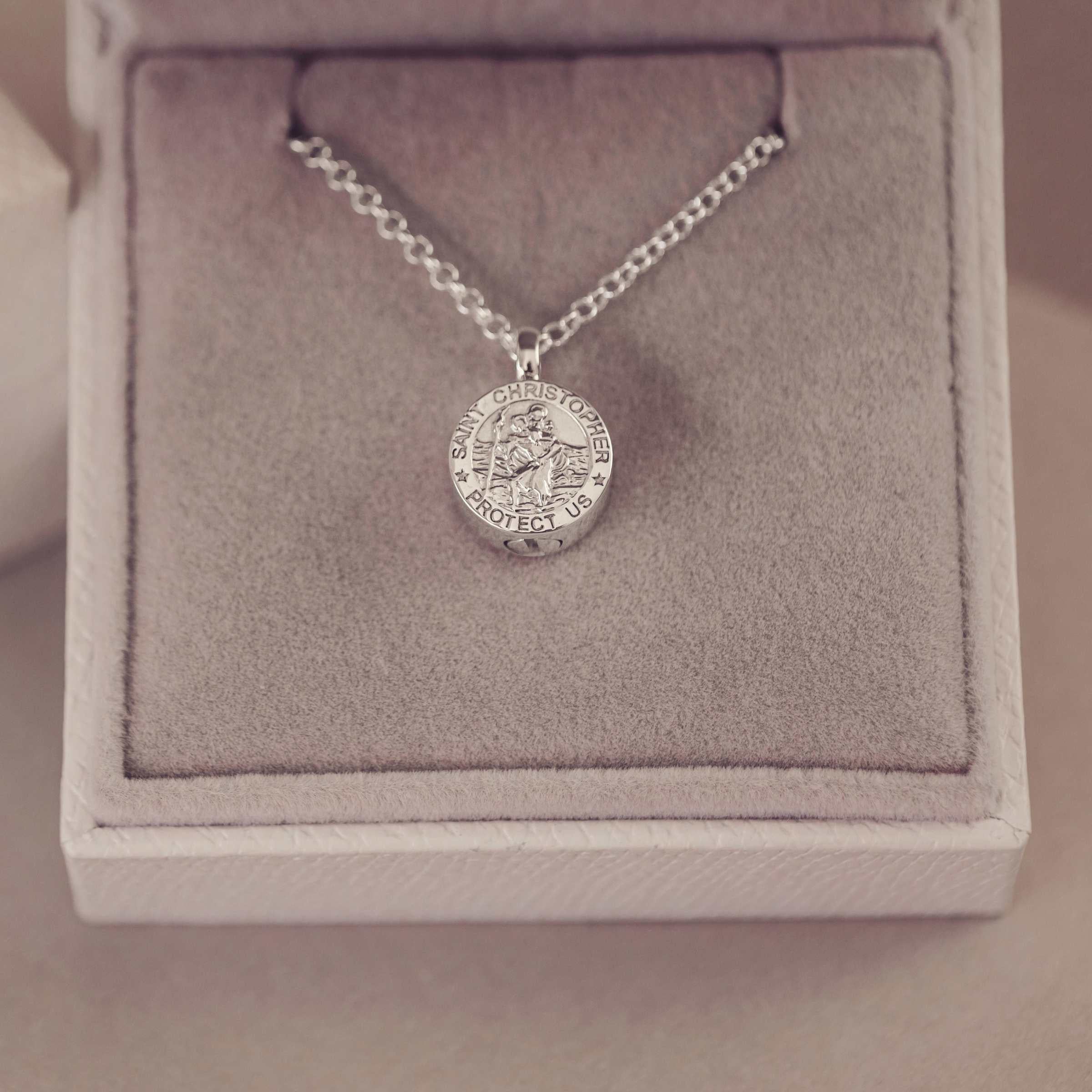 Silver necklace with a St Christopher pendant in a jewellery box
