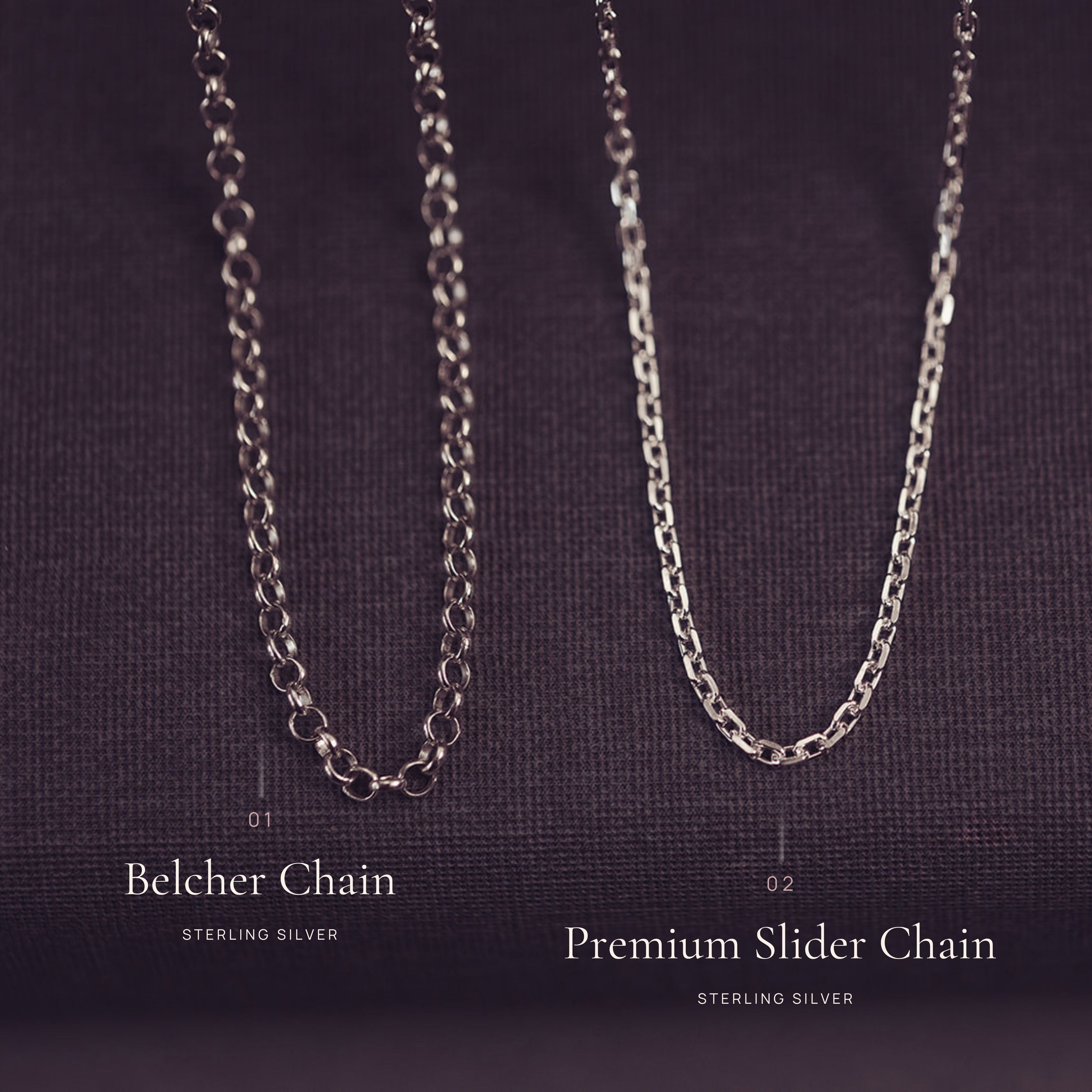Two silver chains, a Belcher chain and a Premium Slider chain, on a dark background.