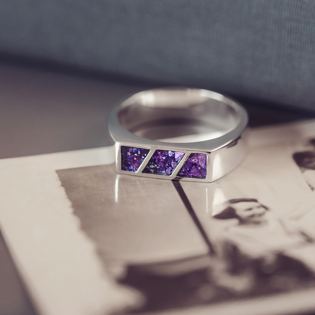 Silver ring with purple gemstones on an old photograph