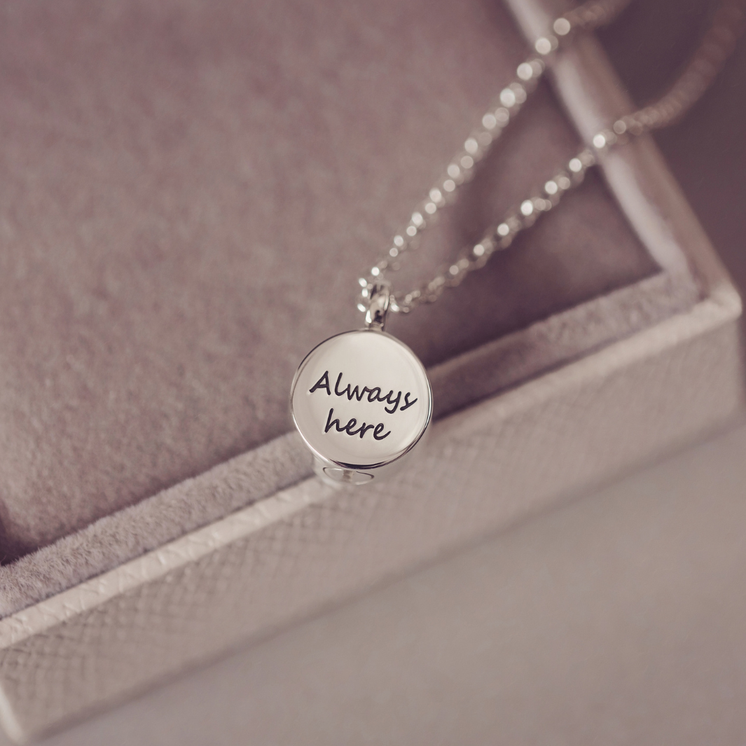 Silver necklace with "Aways here" engraved