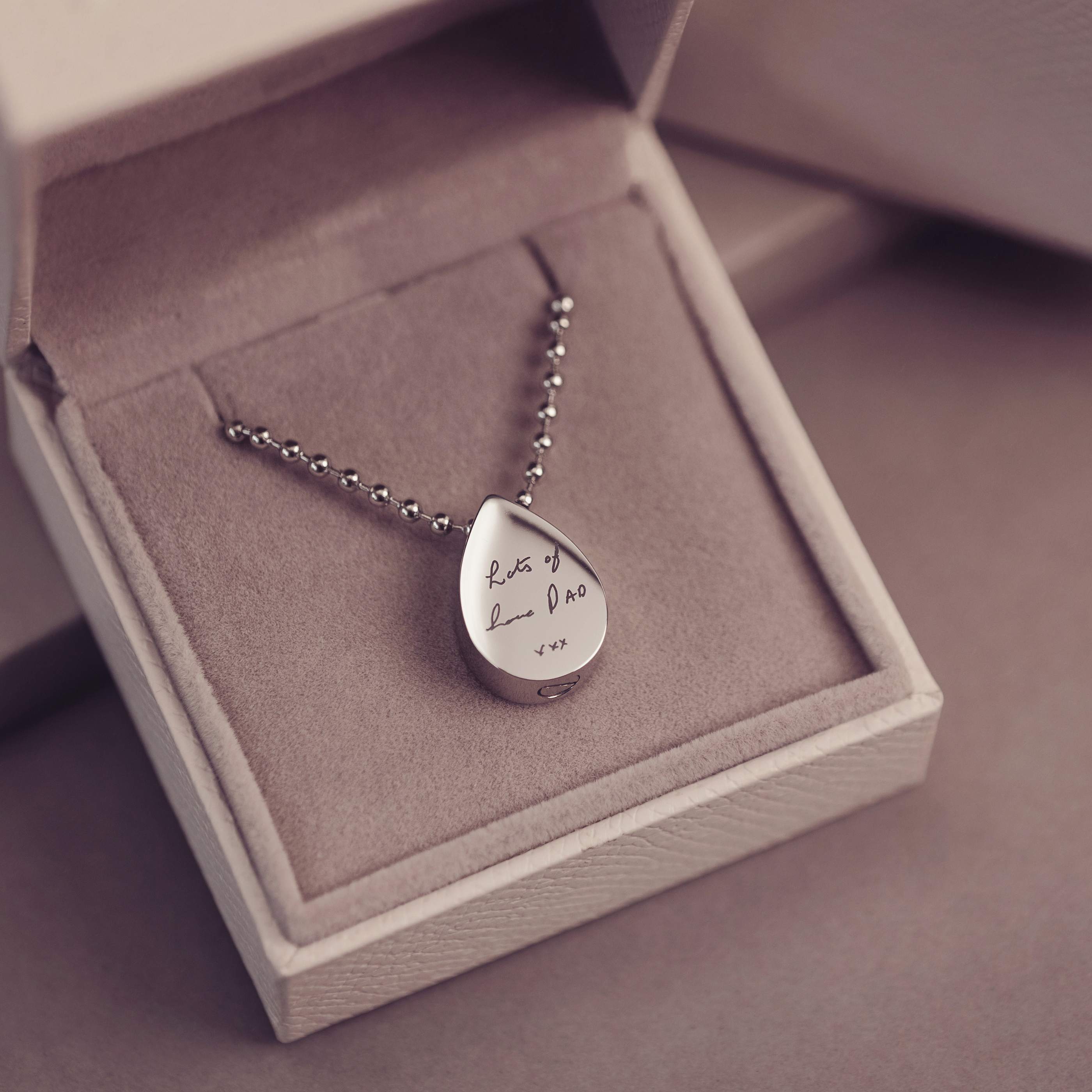 Silver teardrop pendant necklace in a jewelry box