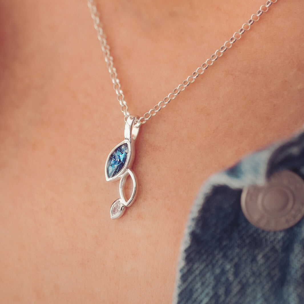 Cremation ashes marquis style cascade necklace on a silver chain, filled with blue crystal and ashes