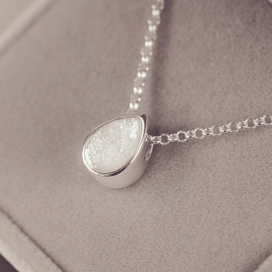 Peardrop shaped silver pendant, filled with white crystal & cremation ashes, on a silver chain
