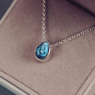 Peardrop shaped silver pendant, filled with blue crystal & cremation ashes, on a silver chain