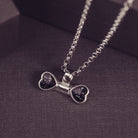 sterling silver bone shaped necklace, filled with cremation ashes, black crystal and resin.