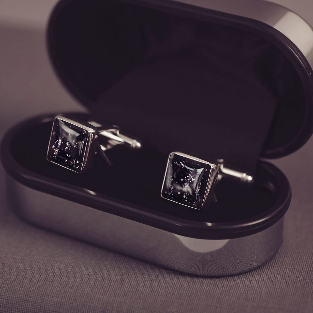 Square silver cufflinks containing cremation ashes, black crystal and resin