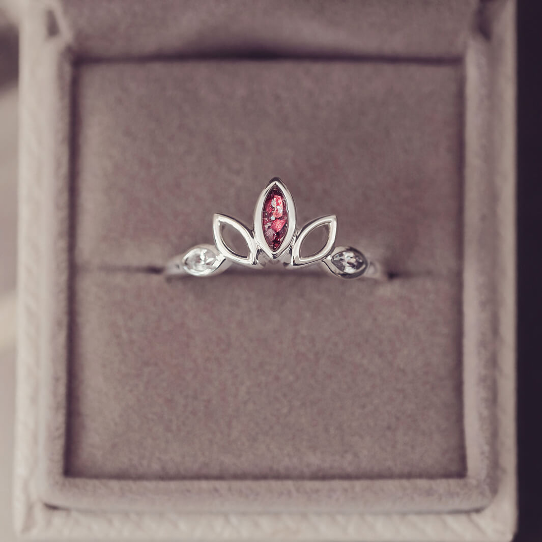 Sterling Silver Ring, created with your loved ones ashes, with Cubic Zircona gemstones. Red floating crystals with in piece in a grey jewellery box