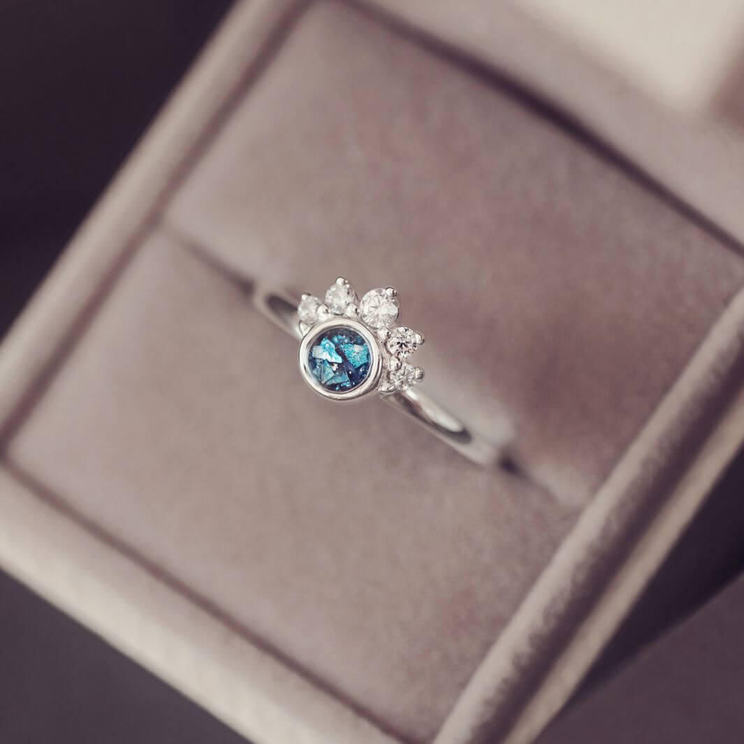 Sterling Silver Ornate Ring with blue gemstone, in a grey jewellery box
